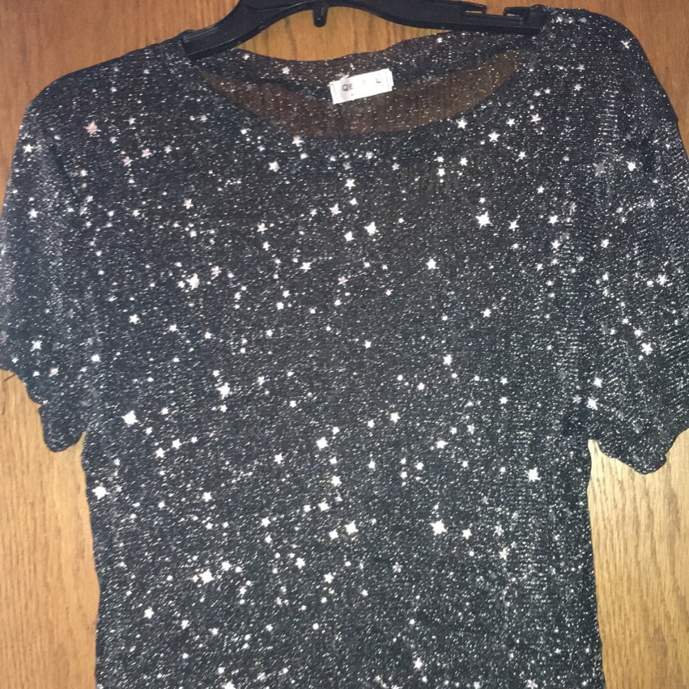 sheer black top with stars and glitter